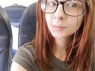 Cute pornstar fingers herself in airplane bathroom